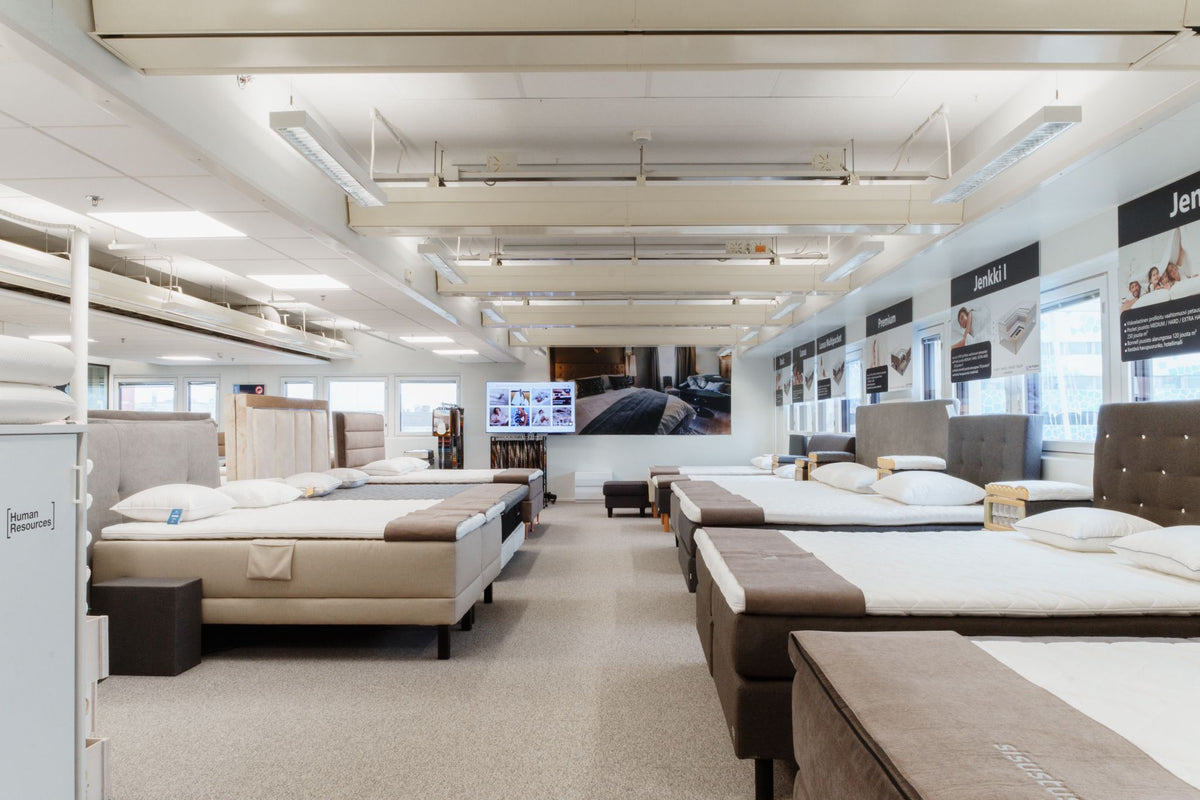 Beds and upholstered headboards at the Sisustus1 showroom in Helsinki.