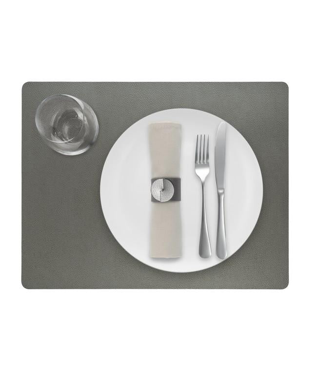 Grey rectangular Finesse placemat with a white plate, cutlery and glass viewed from above