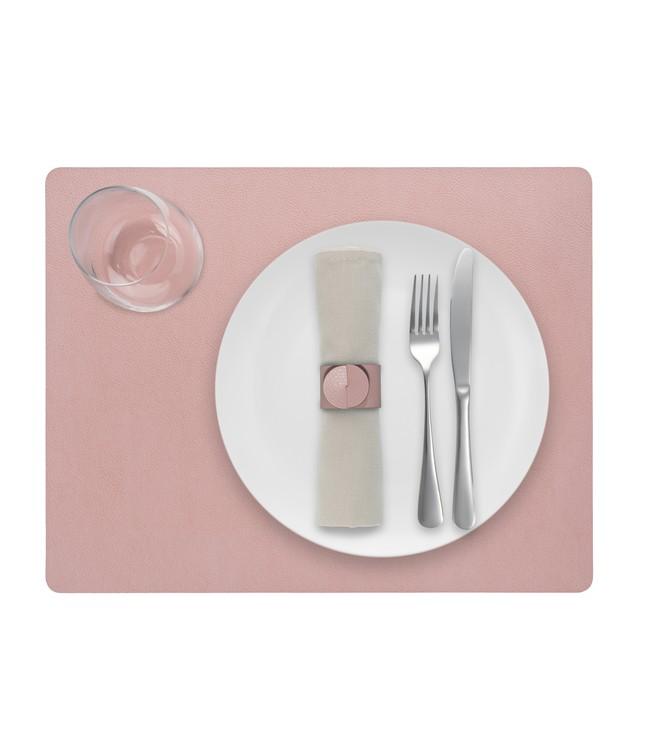 Pink rectangular Finesse placemat with a white plate, cutlery and glass viewed from above