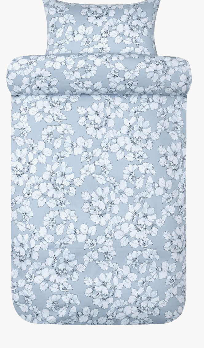 Light blue Høie Amelia duvet cover and pillowcase with a white leaf pattern shown in full