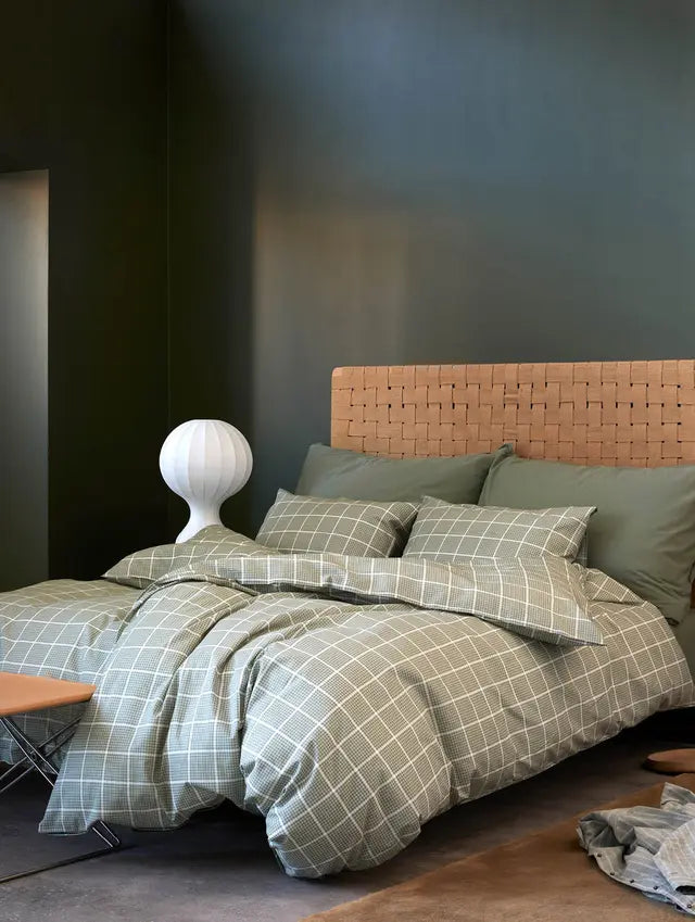 Green white-checked Høie Eddie duvet cover set on a made bed in a bedroom