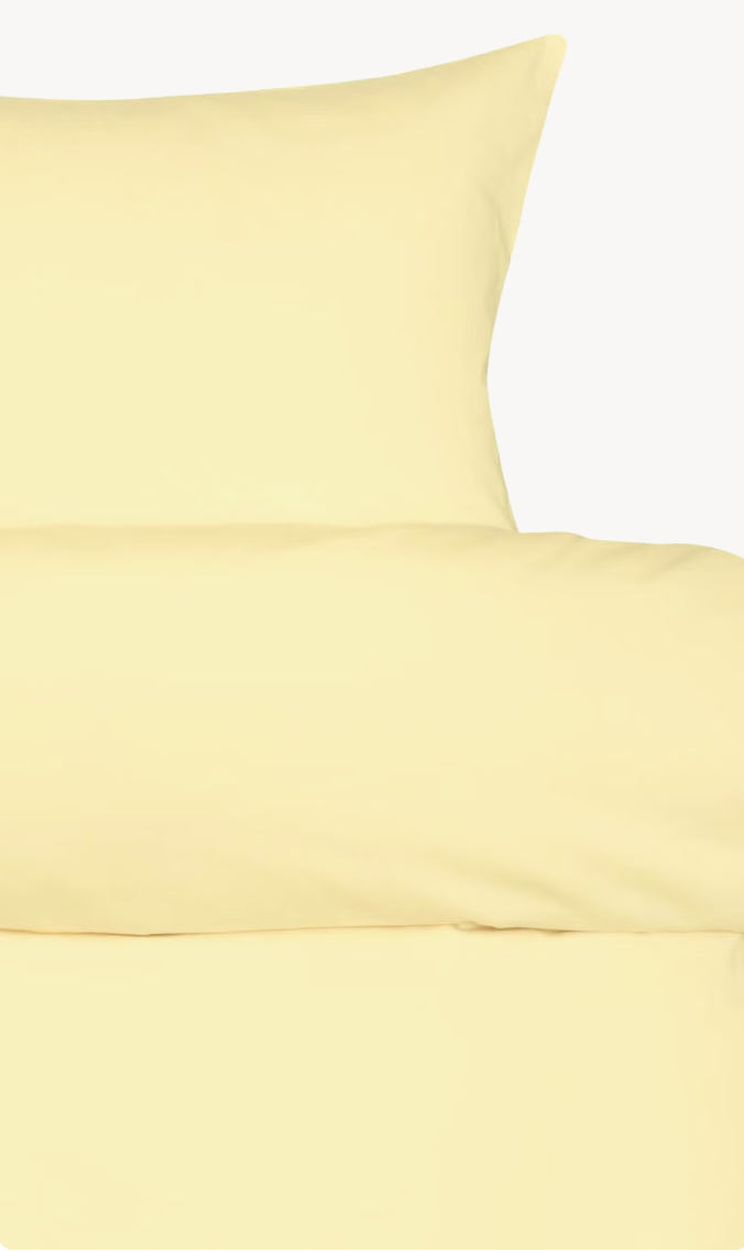 Yellow Høie Harmoni duvet cover set showing the pillowcase and turned-down top edge