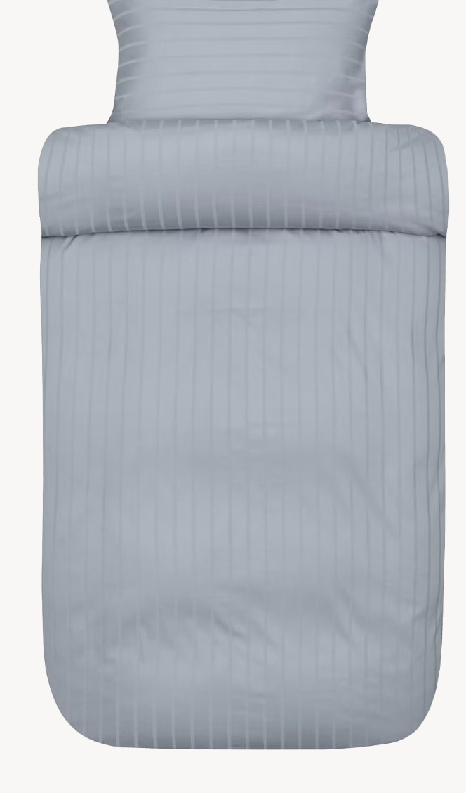 Light blue Høie Milano duvet cover set shown in full against a white background; subtle tonal stripes