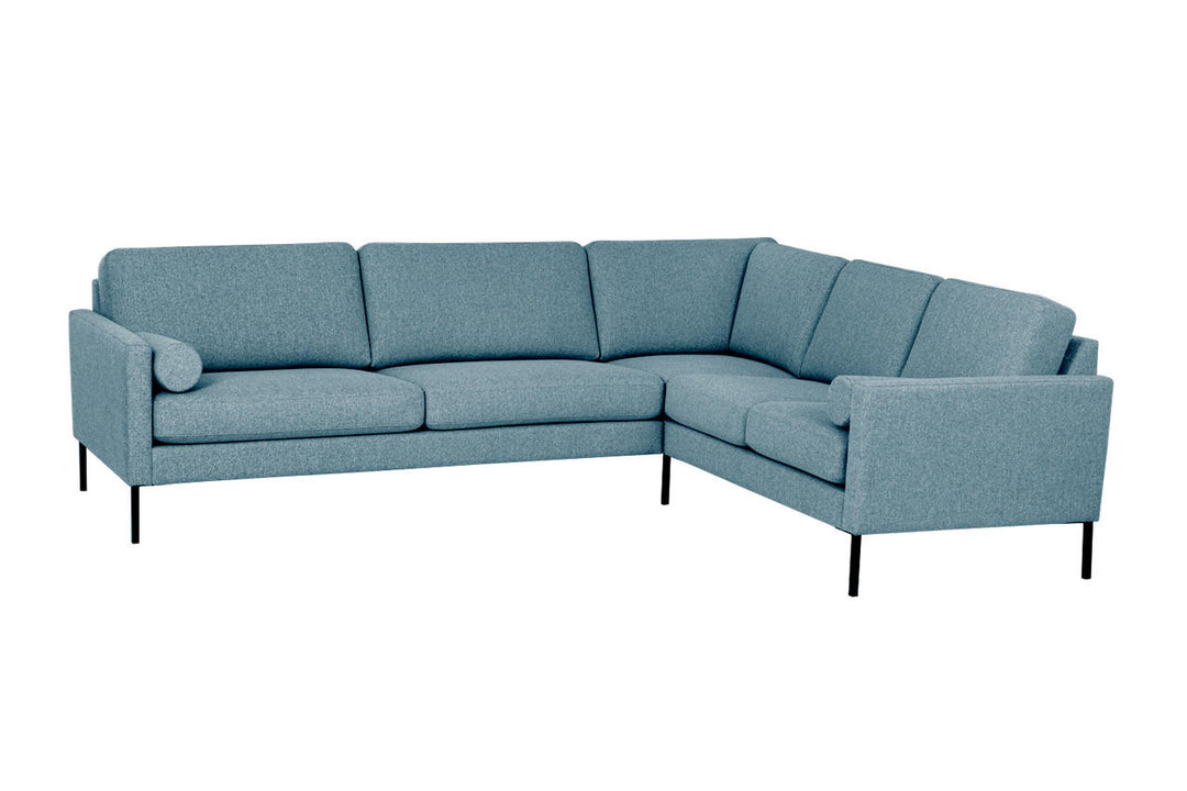 Blue Hotel Luxus Elegant corner sofa with black legs viewed from the front at an angle
