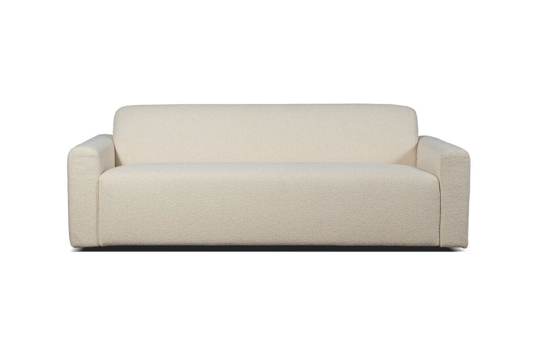 Cream straight Heta sofa from the front with a continuous seat and narrow armrests