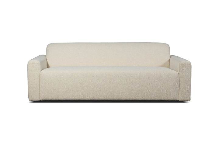 Cream straight Heta sofa from the front with a continuous seat and narrow armrests