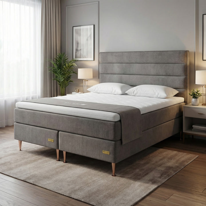 Grey No Problem Hotel Luxus 3 continental bed in a bedroom with a tall horizontally padded headboard