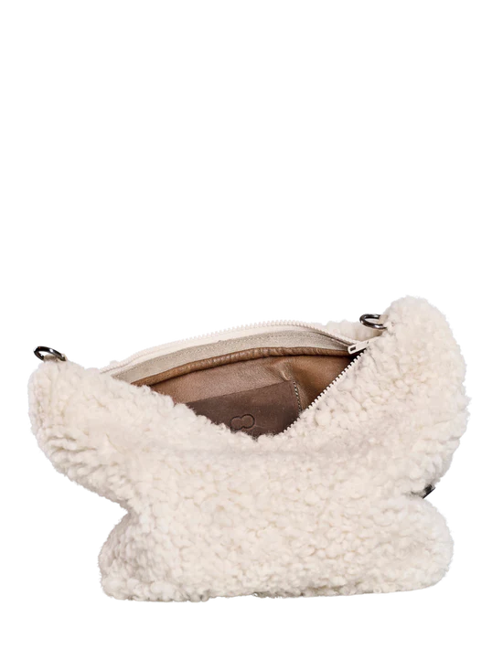 White KYWIE sheepswool bag open from above at an angle showing its brown lining