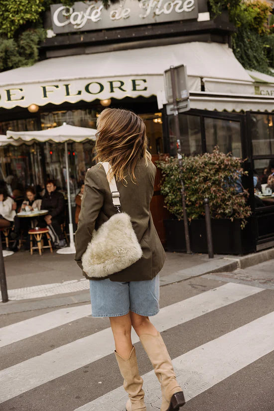 Light long-haired KYWIE Stone bag on a person's shoulder viewed from behind at an angle